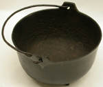 an%20iron%20kettle%20with%20a%20round%20bottom